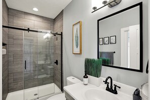 Shower, hair dryer, towels, soap