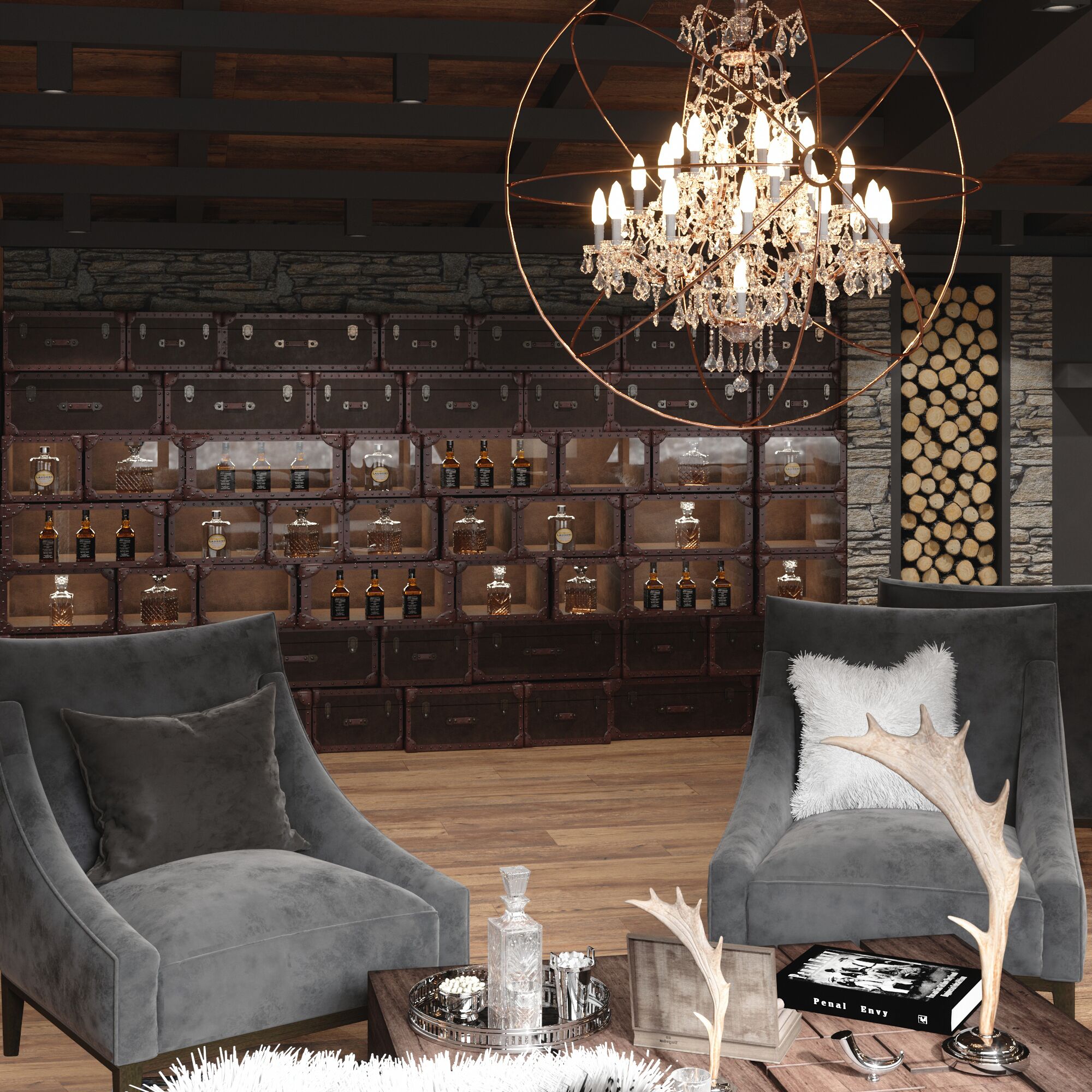 A room with two grey armchairs, a wooden coffee table with a book and decorative items, a chandelier, and a wall of wooden crates displaying bottles.