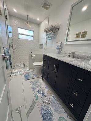 Shower, hair dryer, towels, soap