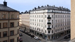 A multi-story building with a classical architectural style, featuring symmetrical windows and a central entrance.