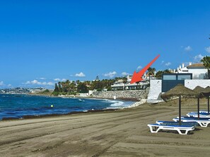 On the beach, beach towels - Beachfront apartment with pleasant views of the sea and the historic lighthouse. (MIJAS COSTA)