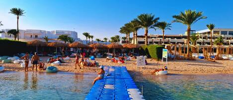 On the beach, sun loungers, beach towels