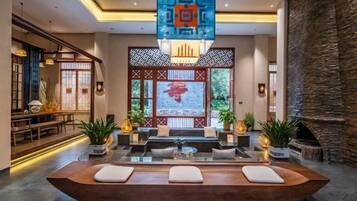 A reception area with a reception desk, seating, and decorative elements.