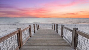 A wooden boardwalk leading to a beach with a sunset in the background. - WindMark | Golf Cart | Pet Friendly | In-Law Suite (Port St Joe)