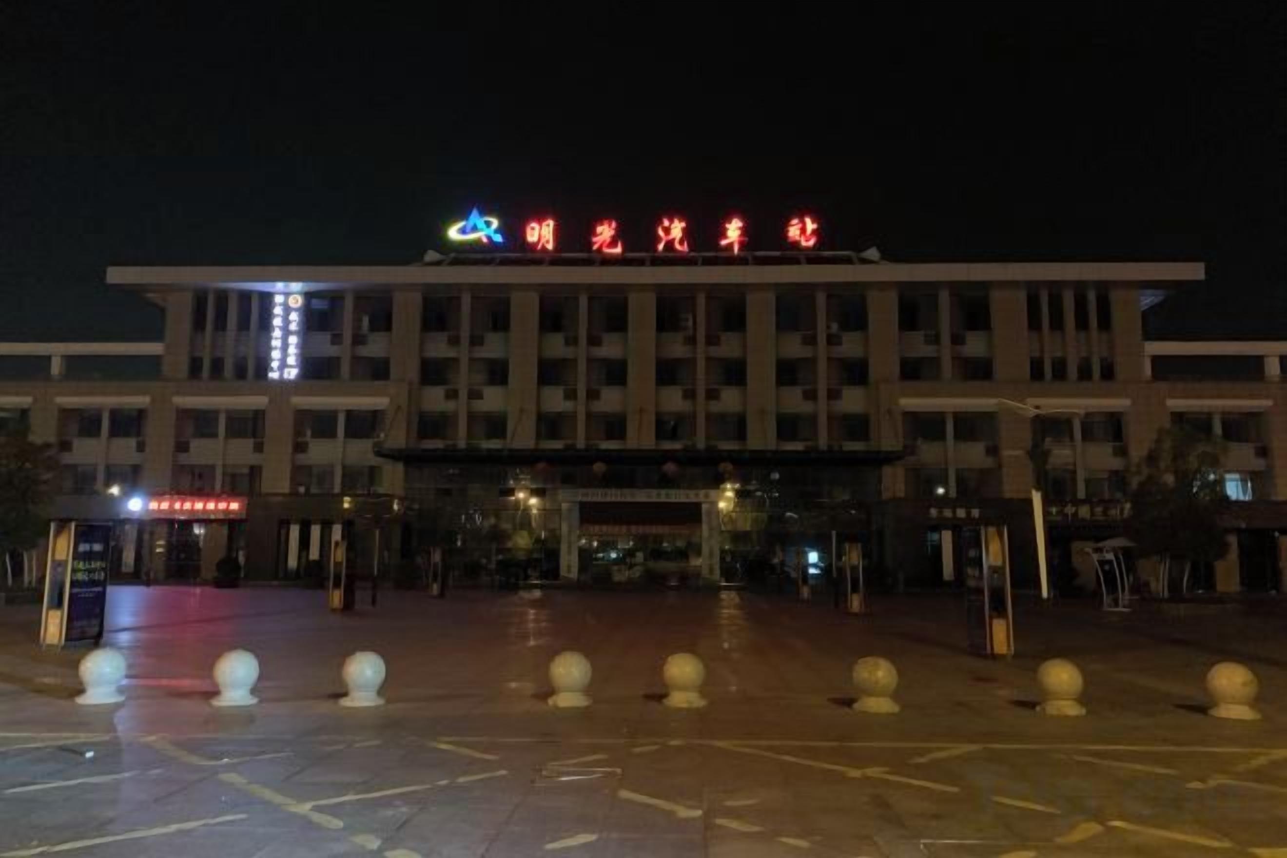 A building with a sign that reads 'Sunrise Hotel'.