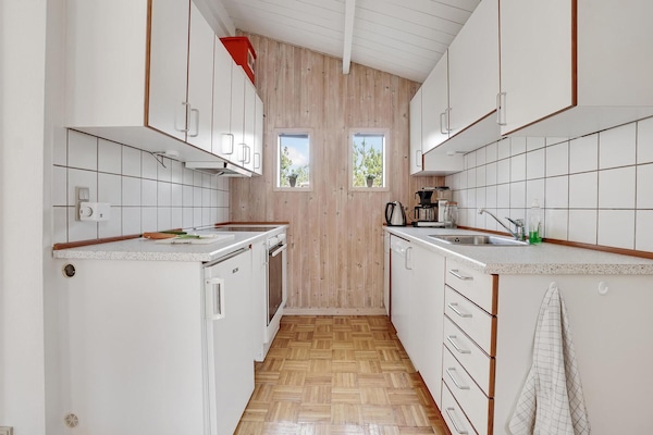 Fridge, stovetop, dishwasher, coffee/tea maker