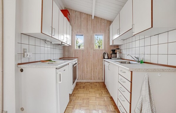 Fridge, stovetop, dishwasher, coffee/tea maker