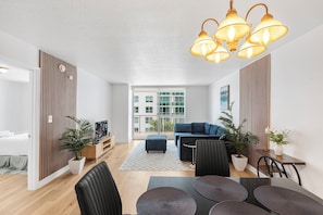 Luxury Condo, 1 Bedroom, City View | Living area | 50-inch Smart TV with cable channels, TV