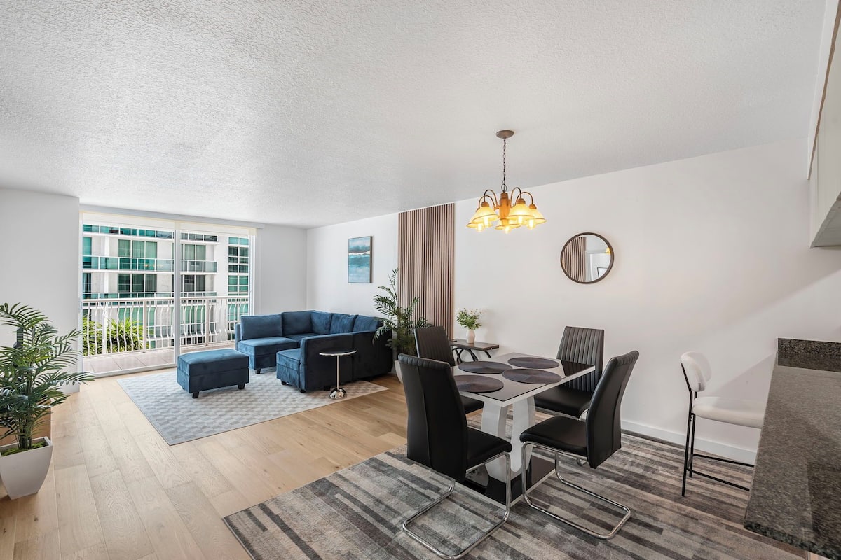 Luxury Condo, 1 Bedroom, City View | Living area | 50-inch Smart TV with cable channels, TV