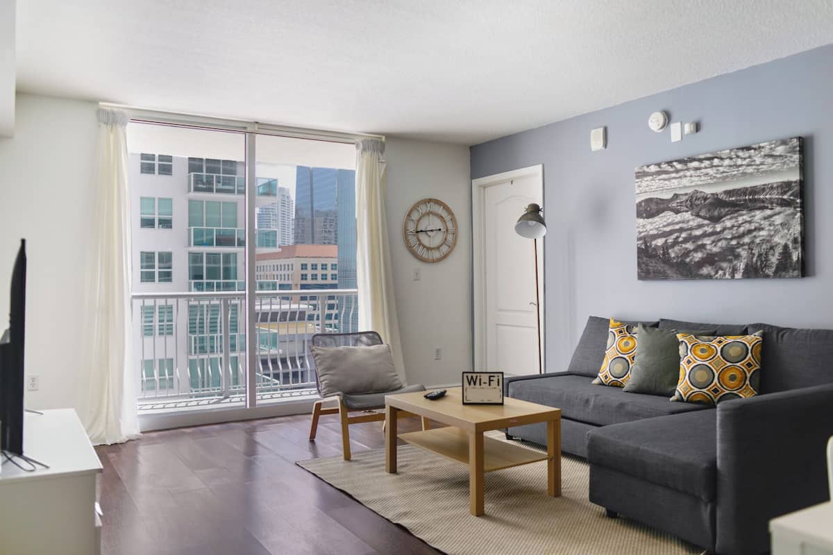Luxury Condo, 2 Bedrooms, City View | Living area | 50-inch Smart TV with cable channels, TV