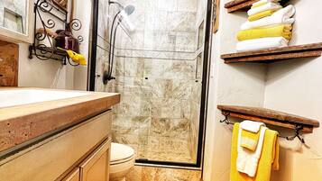 Shower, hair dryer, towels, soap