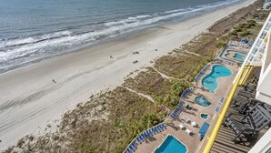 A beach resort with a pool area, beach access, and ocean views. - Tropical oceanfront resort with shops, restaurants, pools, lazy river-paradise! Sleeps 4. (North Myrtle Beach)