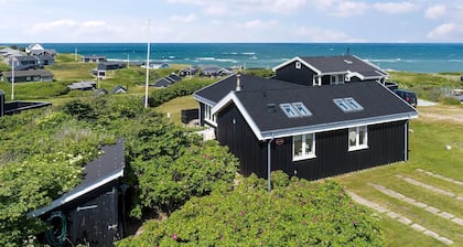 Meerblick und Ladestation für Elektroauto