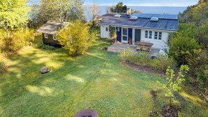 A house with a deck, a small shed, and a view of the sea. - Cottage on Fur island with exceptional sea view (Fur)