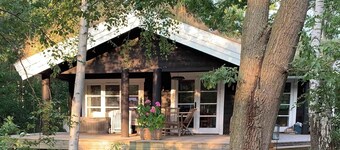 Log house near a child-friendly sandy.