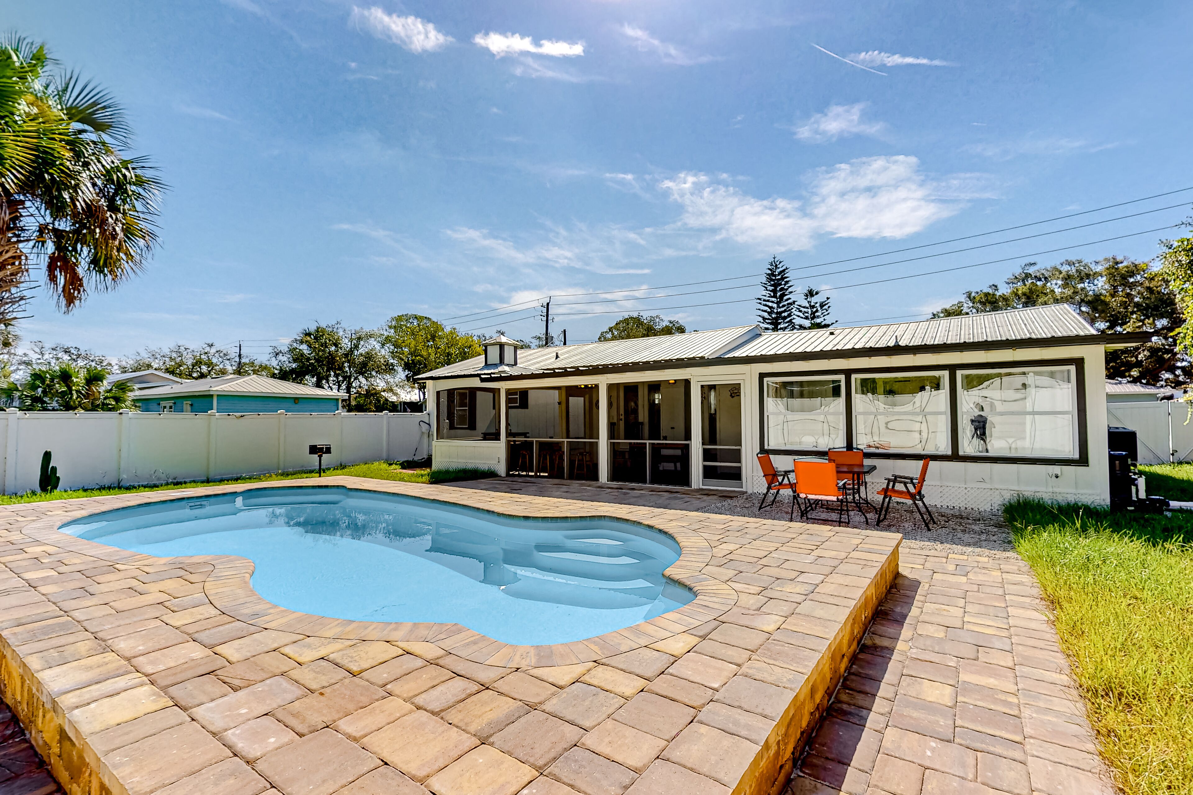 Welcoming dog-friendly pool home with full kitchen, enclosed yard, central AC