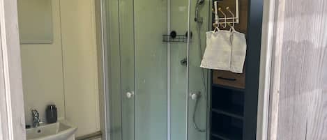 Shower, hair dryer, towels, soap