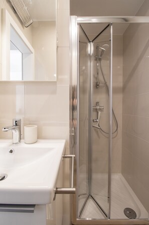Shower, hair dryer, towels, soap