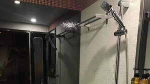 A modern bathroom with a toilet, bidet, and shower. - KMB hostel (Kowloon)