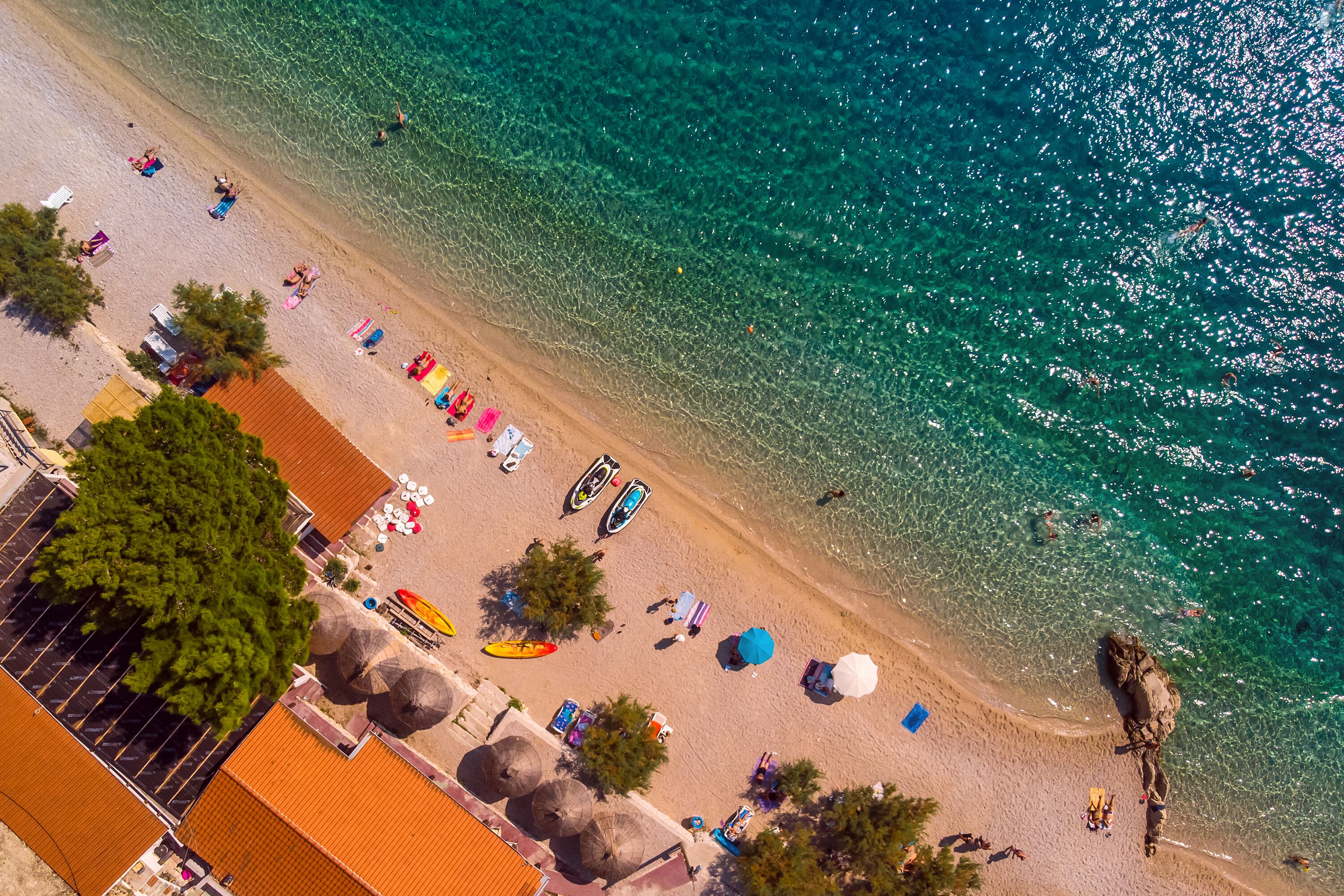 On the beach, sun-loungers