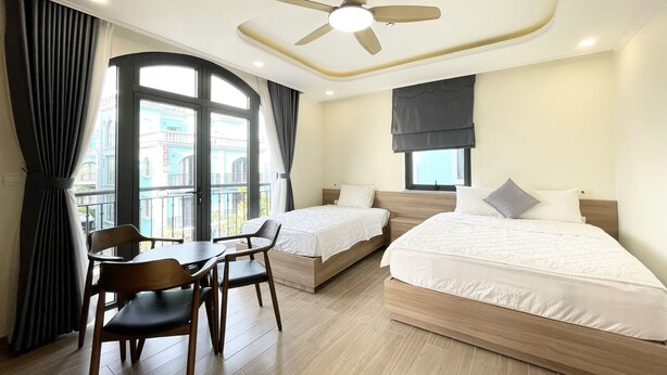 Deluxe Triple Room | Hypo-allergenic bedding available, minibar, desk, laptop workspace - Cam Phu Quoc Hotel (Phu Quoc)