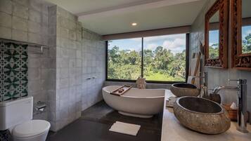 Separate tub and shower, rainfall showerhead, designer toiletries