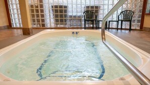 A hot tub with a visible temperature gauge set at 38°C. - Comfy Room Along Banff Ave! Air-Conditioning (Banff)