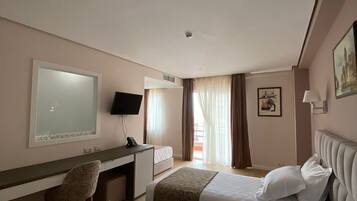 Standard Triple Room | Minibar, individually furnished, desk, laptop workspace