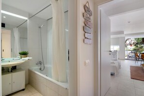Bathtub, hair dryer, towels