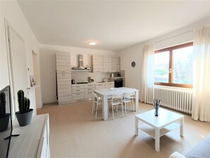 Apartment | Living area | 40-inch flat-screen TV with cable channels, TV - Winter Spring Summer Apartments (Mergozzo)