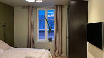 1 bedroom, desk, iron/ironing board, travel crib