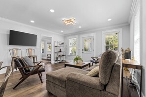 Signature House, 3 Bedrooms, Patio, Courtyard View | Living room | 40-inch flat-screen TV with digital channels, TV, fireplace - Bright and Modern Close to Everything (Charlotte)