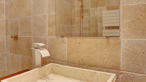 A bathroom with a large square sink, a glass shower enclosure, and a mirror with a light fixture above it. - Superior apartment, 400m from the Palais des Festivals (Cannes)