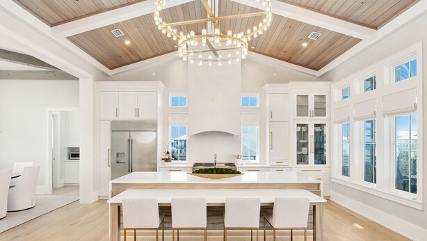 A spacious kitchen with a large island, white cabinetry, and a wooden ceiling. - Grayt Joy|Private Community Beach Access|Unobstructed Gulf Views (Santa Rosa Beach)