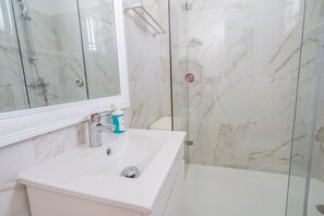 Shower, hair dryer, soap, shampoo