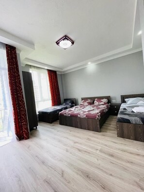 Superior Quadruple Room, Garden View | Premium bedding, blackout drapes, iron/ironing board, free WiFi