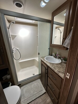 Shower, hair dryer, towels, soap