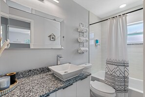 Hair dryer, towels, soap, shampoo