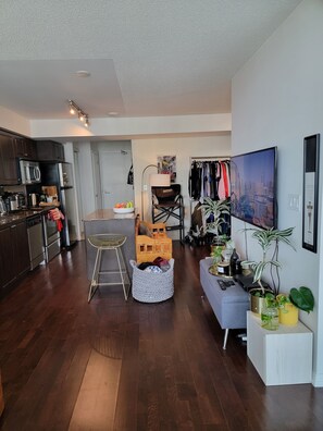 Relax in this stylish living space with a kitchen, dining area, and comfortable seating for a home away from home experience.