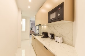 Fridge, microwave, coffee/tea maker, toaster