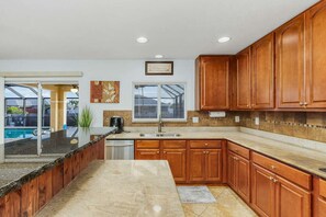 Fridge, microwave, oven, stovetop - Villa Enzo 5BRs, 2.5 BAs, sleeps 20+, 43 feet long heated pool, over 3,100 sqft. (Cape Coral)