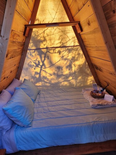 Two cozy pods with water tower