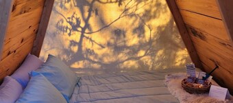 Two cozy pods with water tower