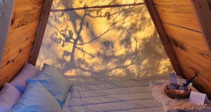 Two cozy pods with water tower