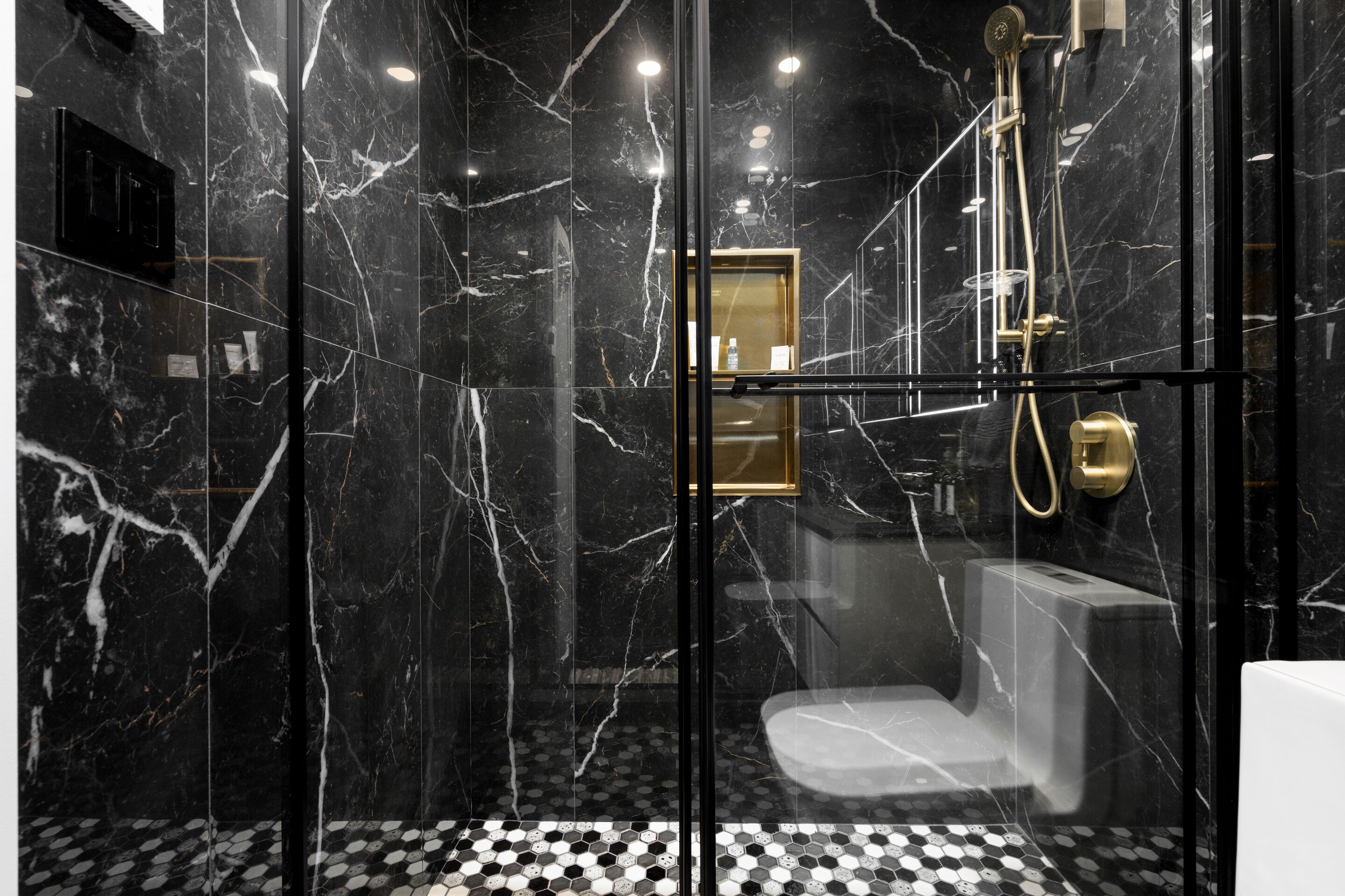 Shower, hair dryer, towels, toilet paper