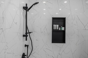 Shower, hair dryer, towels, toilet paper