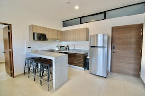 Fridge, microwave, stovetop, coffee/tea maker