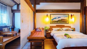 A cozy bedroom with a wooden bed, a nightstand, a bench, and a painting on the wall.
