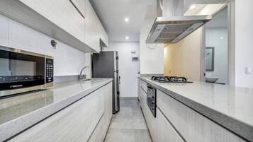 Fridge, microwave, stovetop, coffee/tea maker