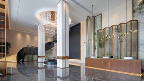 A modern lobby with a reception desk, a staircase, and a decorative light fixture. - GINCO Hotel Guangzhou Baiyun Airport (Guangzhou)